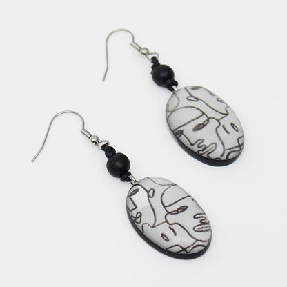 Black and White Faces Dangle Earrings